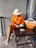 Orange Asante hat