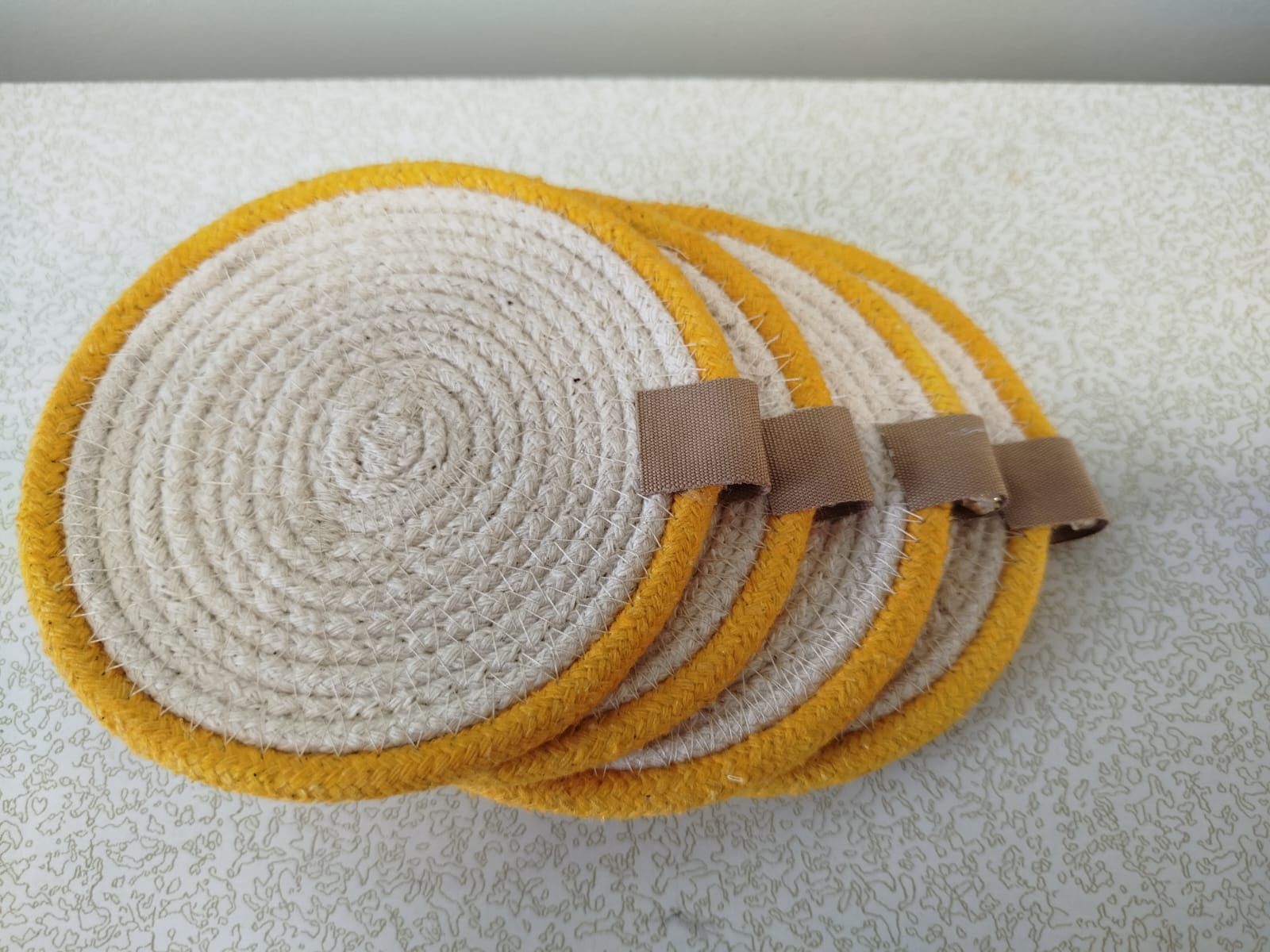 Set of 4 yellow lining coasters 